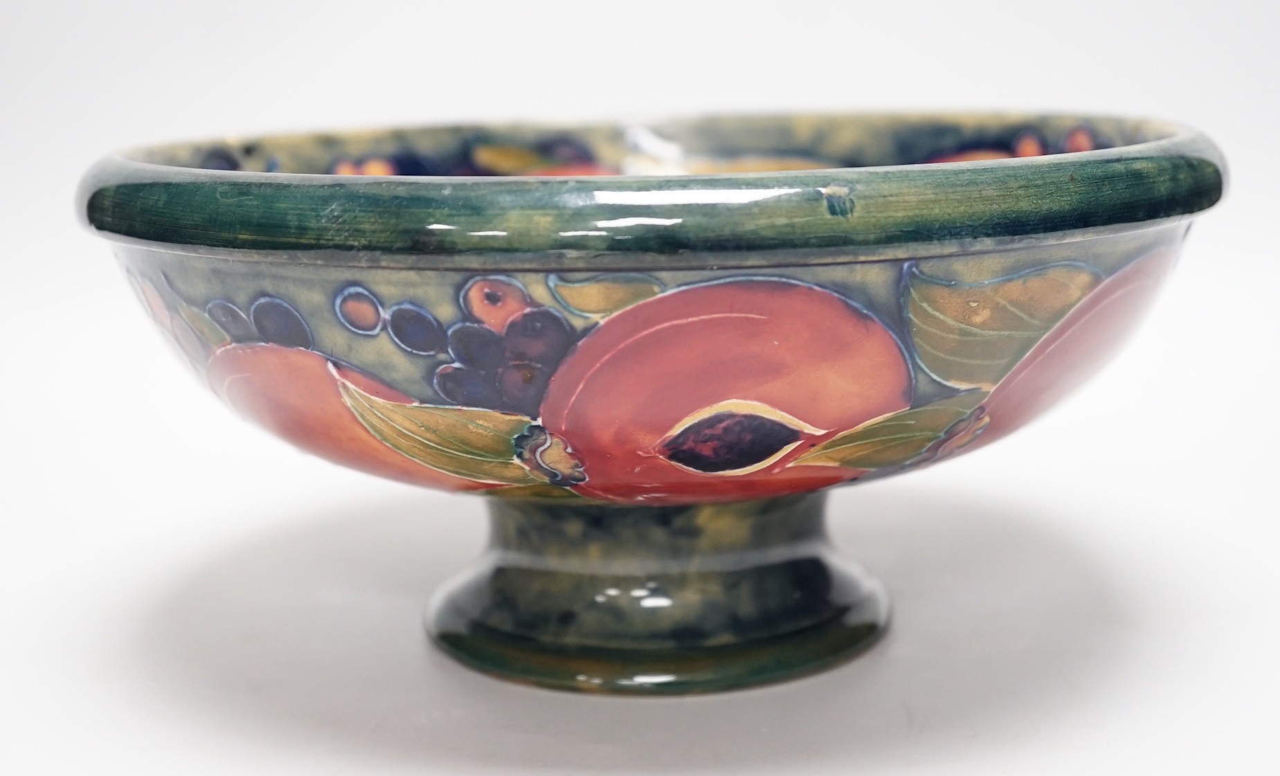 A Moorcroft Pomegranate pedestal bowl, 1920s, 23.5cm diameter